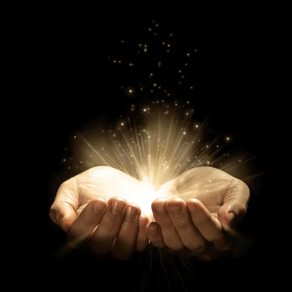 depositphotos_7690104-stock-photo-open-hands-with-glowing